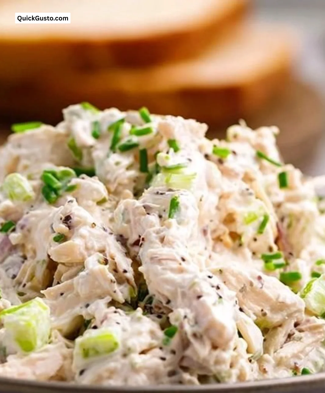 Bowl of simple chicken salad with vegetables and dressing