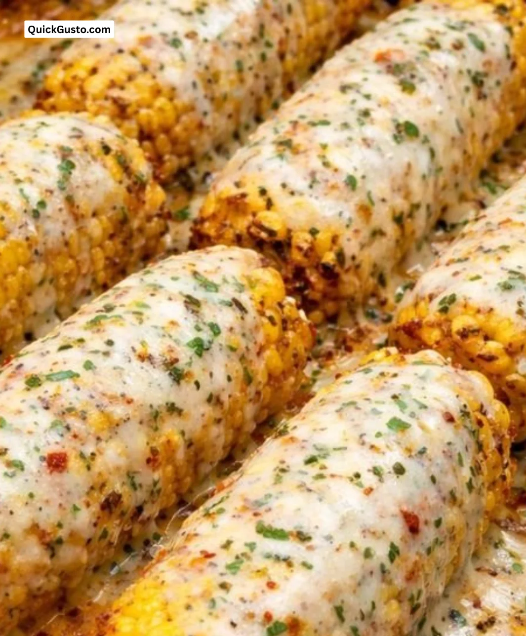Delicious spicy and creamy Cajun corn on the cob with zesty toppings.