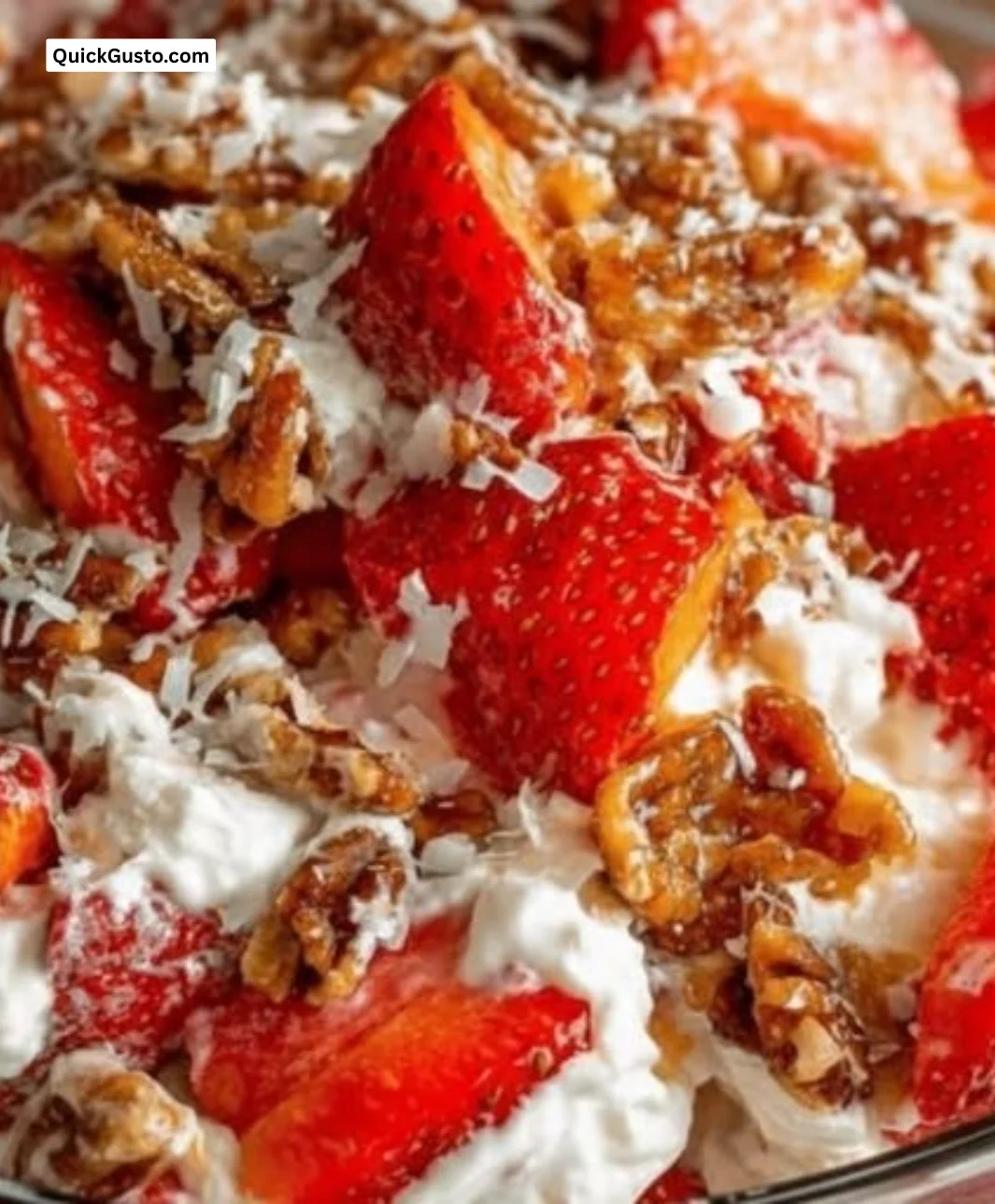 Bowl of refreshing Strawberry Crackle Salad with vibrant fruits and crunchy toppings