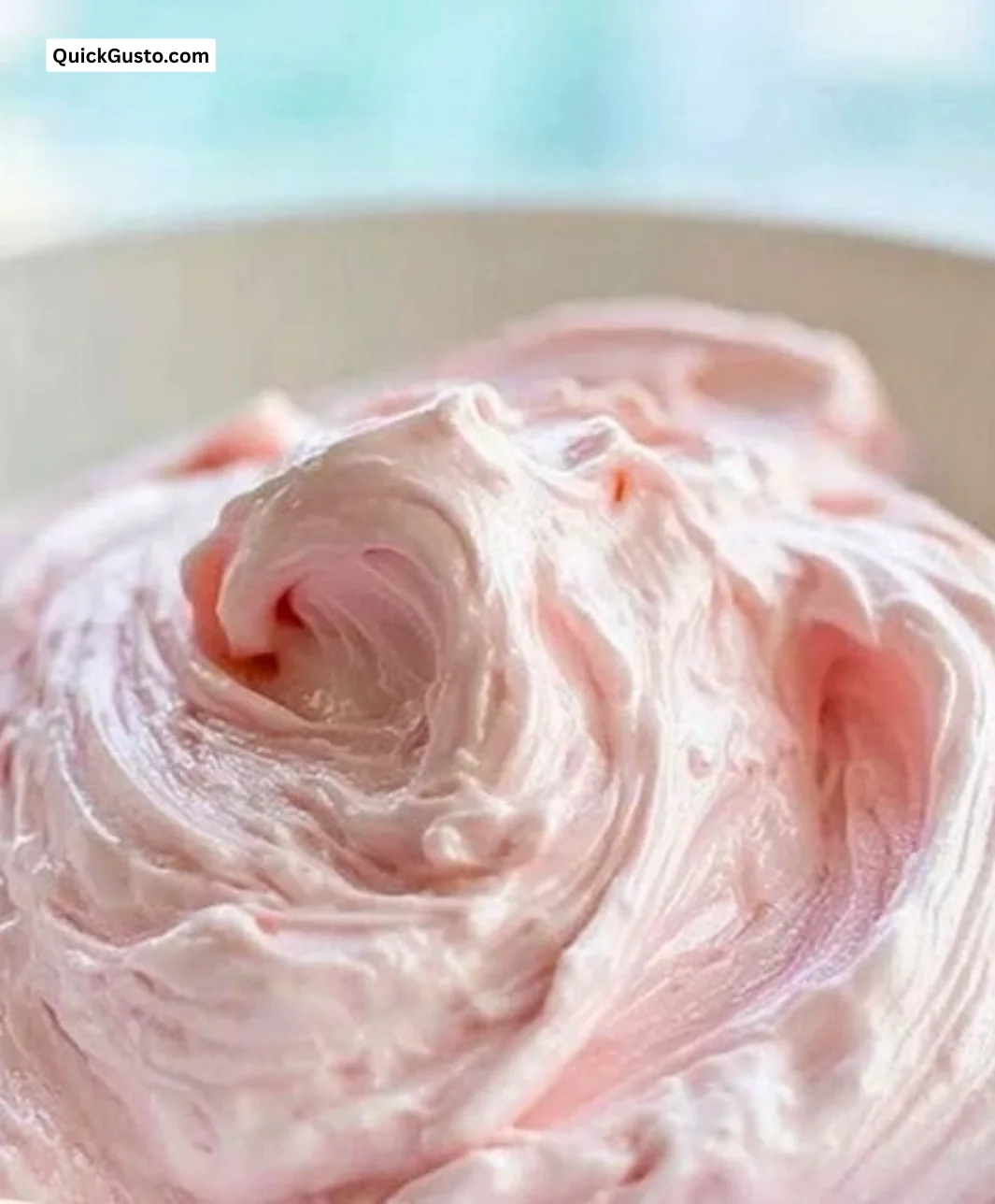 Strawberry marshmallow frosting on a vanilla cake