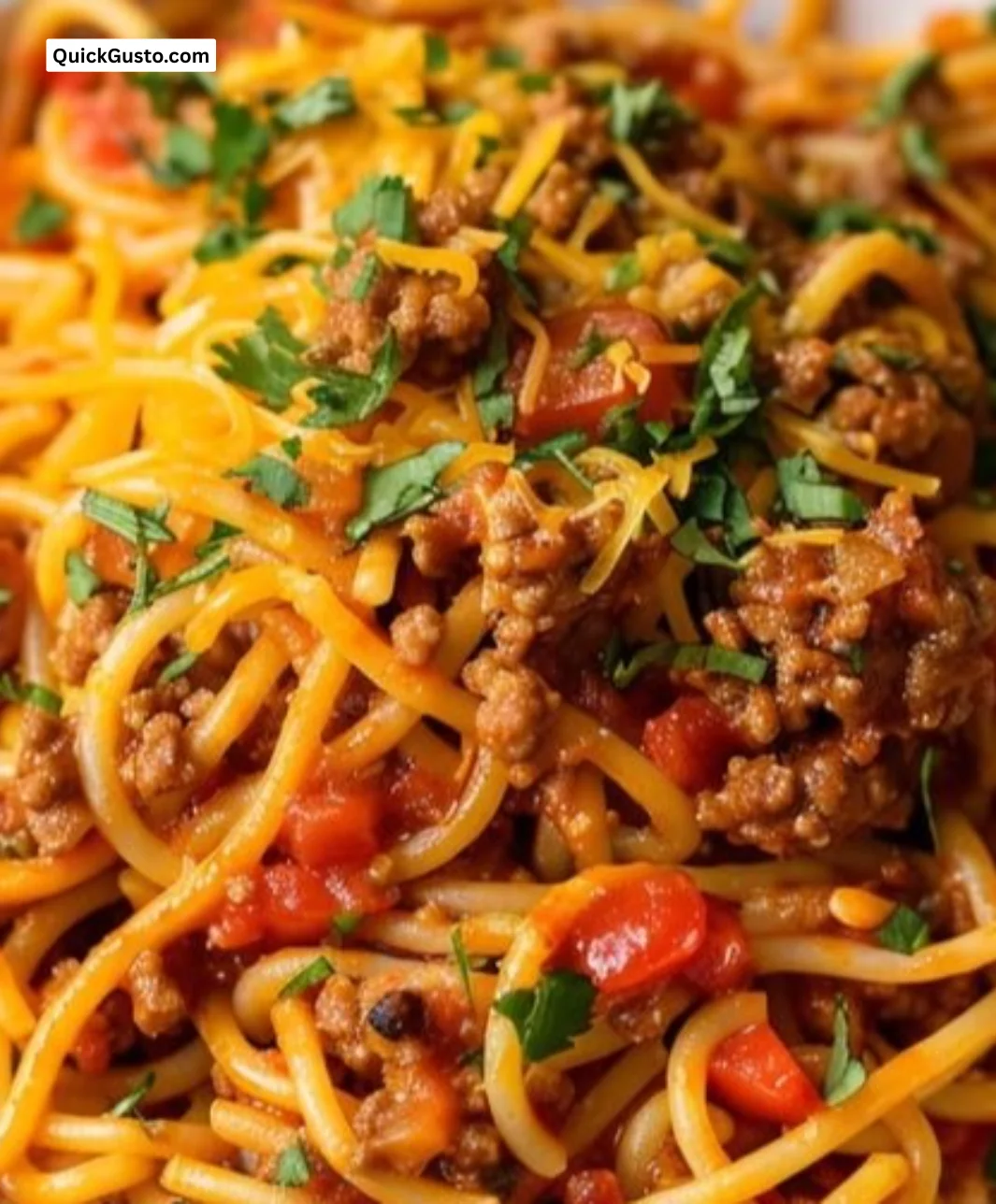 Deliciously plated Taco Spaghetti with toppings and garnishes.