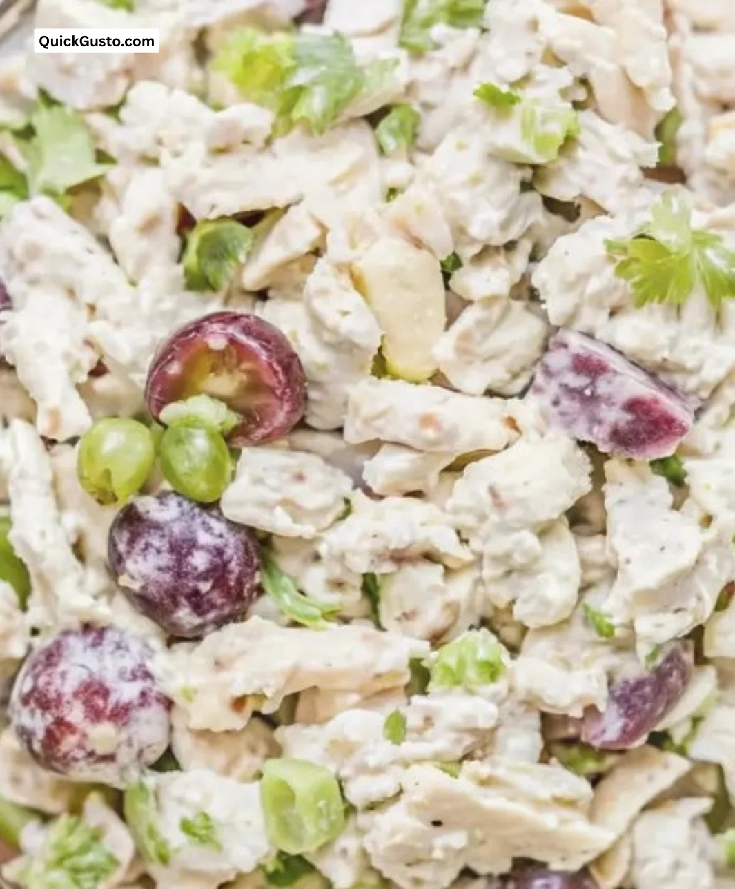 Bowl of ultimate chicken salad with fresh vegetables and herbs