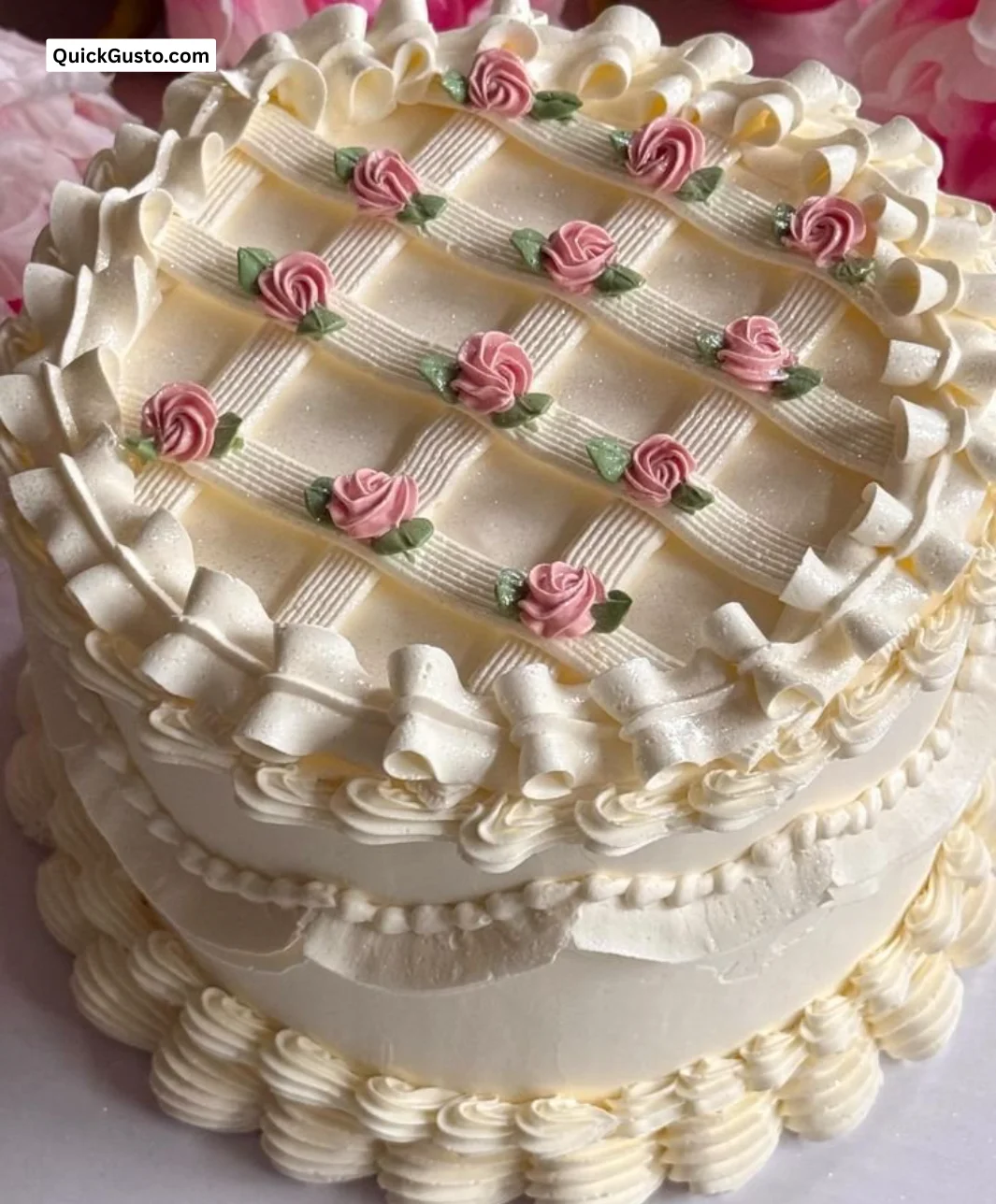 A beautifully decorated vintage floral cake with elegant flowers and intricate details.
