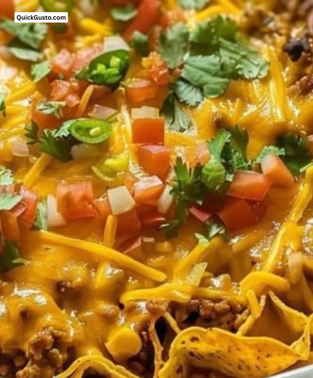 Delicious Walking Taco Casserole topped with cheese and taco ingredients
