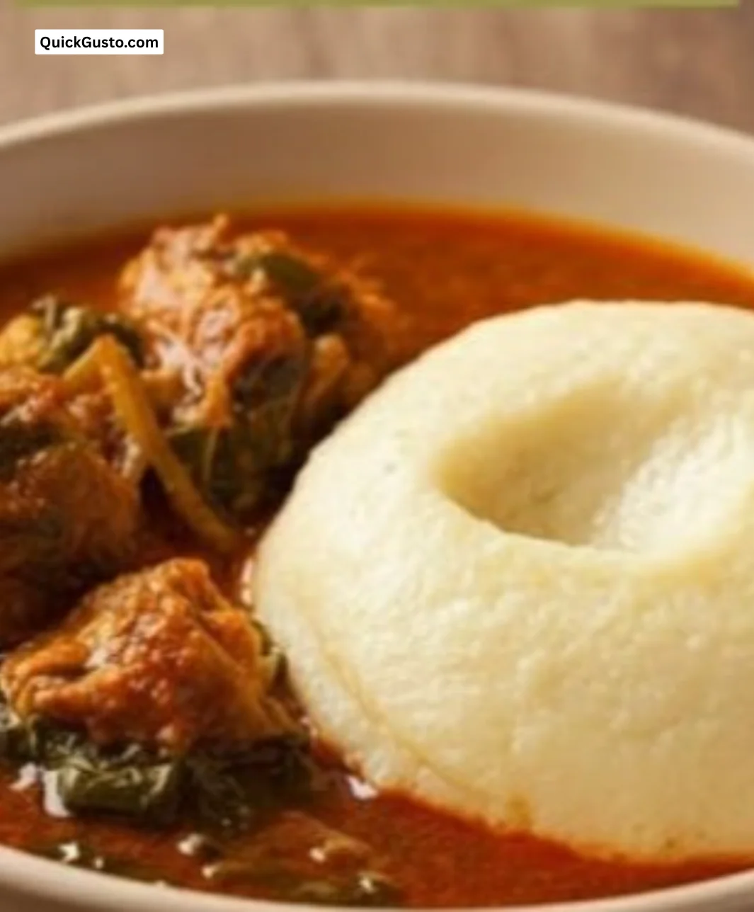 Bowl of authentic fufu served with soup and traditional garnishes