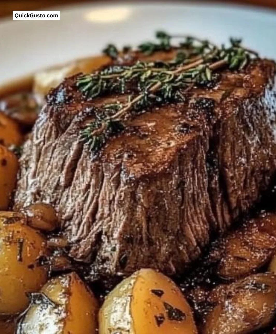 Delicious pot roast cooked in a crock pot, served with vegetables.