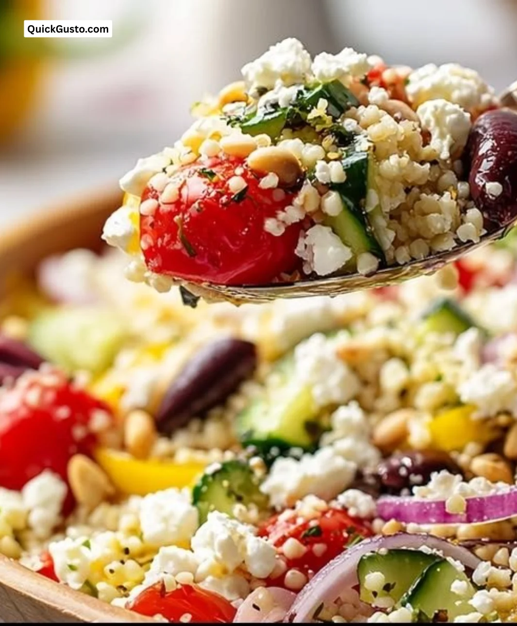Bright and colorful Greek couscous salad with vegetables and feta cheese