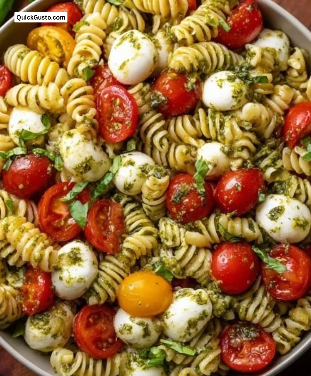 Delicious Caprese Pasta Salad with tomatoes, mozzarella, and fresh basil