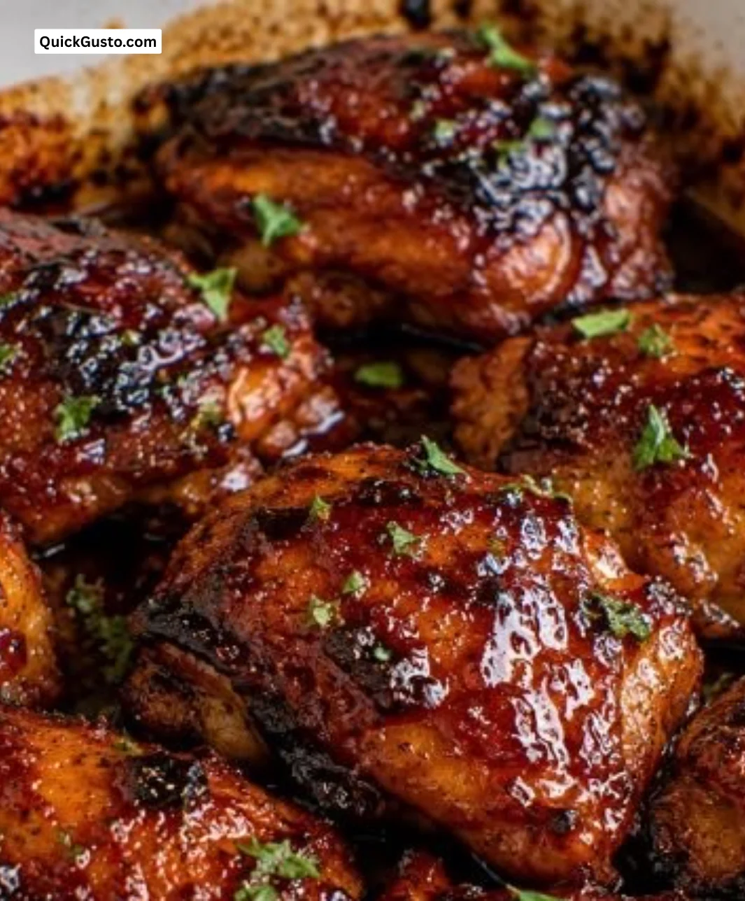 Delicious caramelized BBQ chicken thighs served on a plate