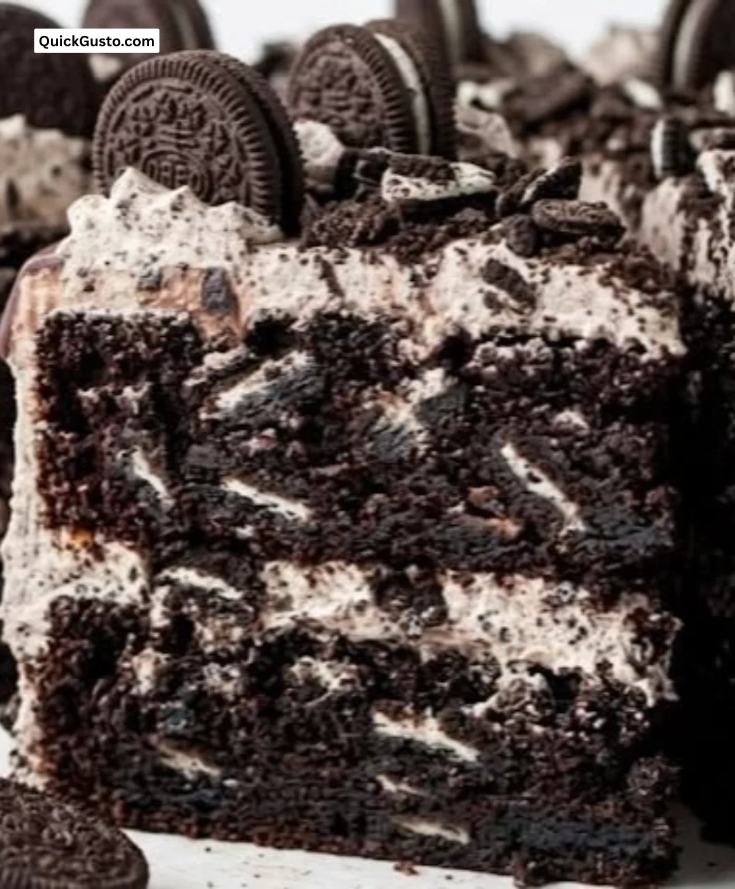 Delicious Chocolate Oreo Cake topped with crushed Oreos and chocolate frosting