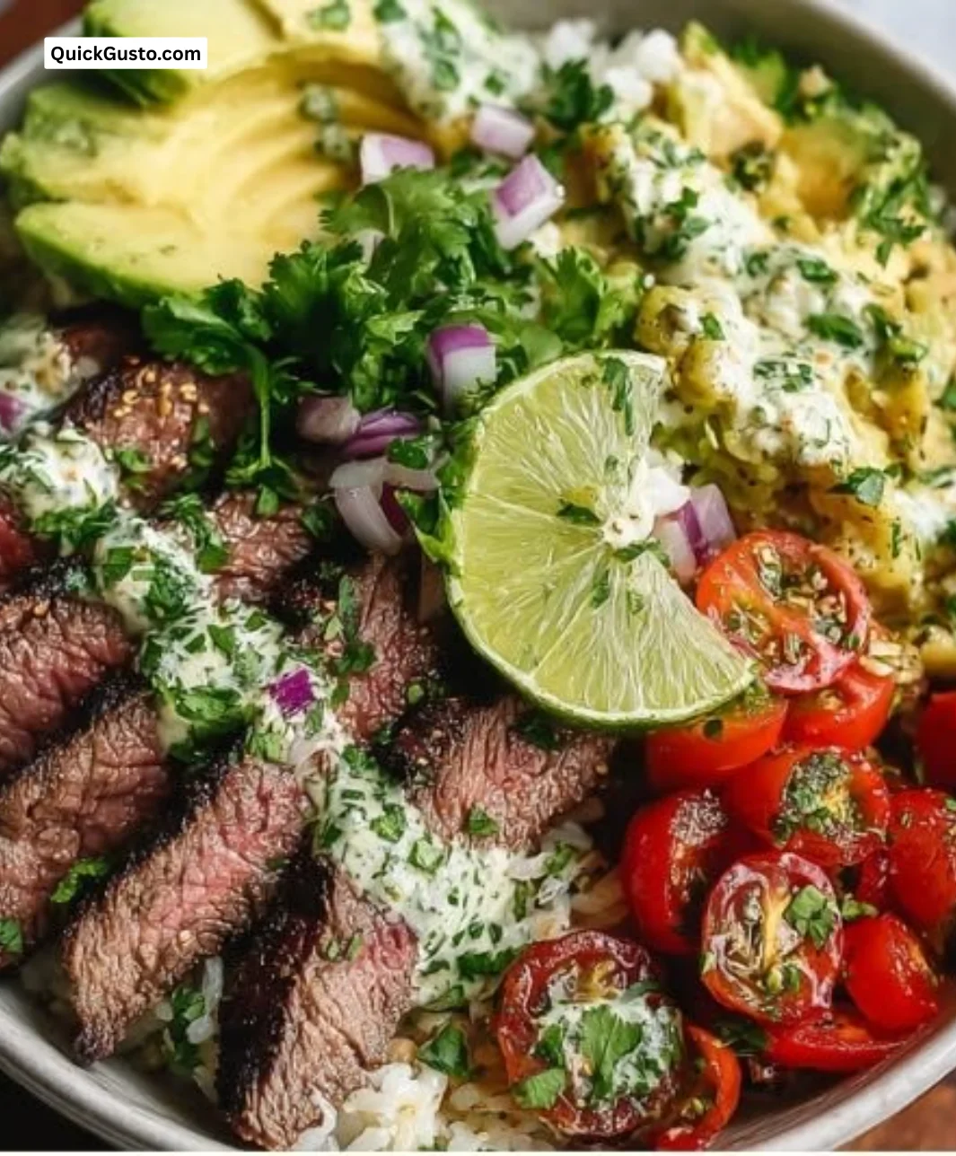 Cilantro lime steak bowls with colorful vegetables and fresh lime garnish