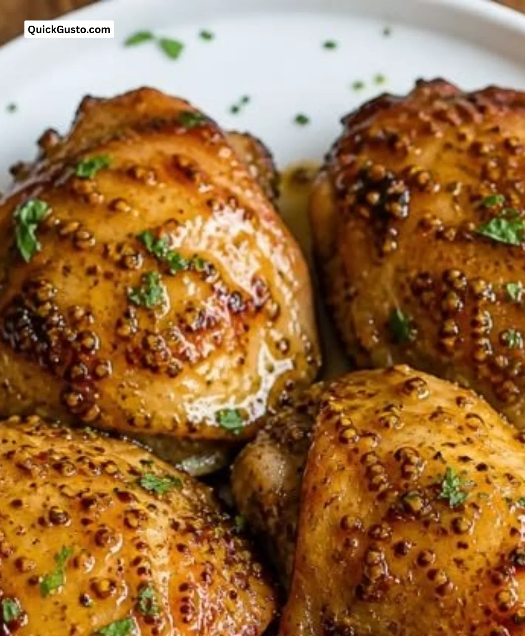 Delicious classic honey mustard chicken thighs served with herbs and sides
