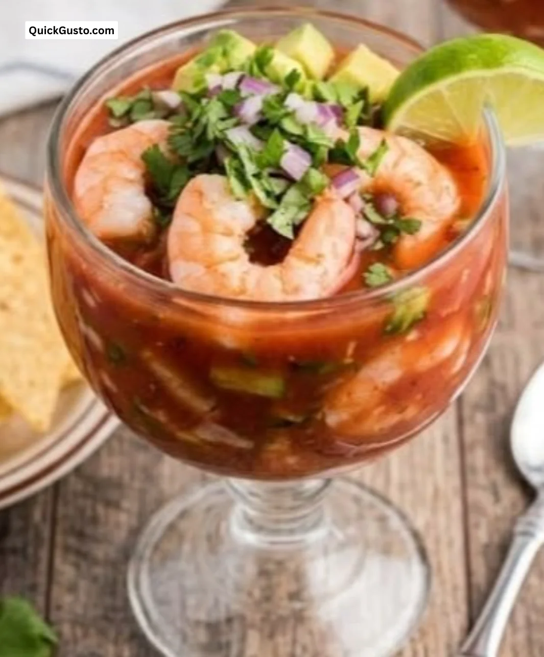 Delicious classic Mexican shrimp cocktail served in a bowl with fresh ingredients.