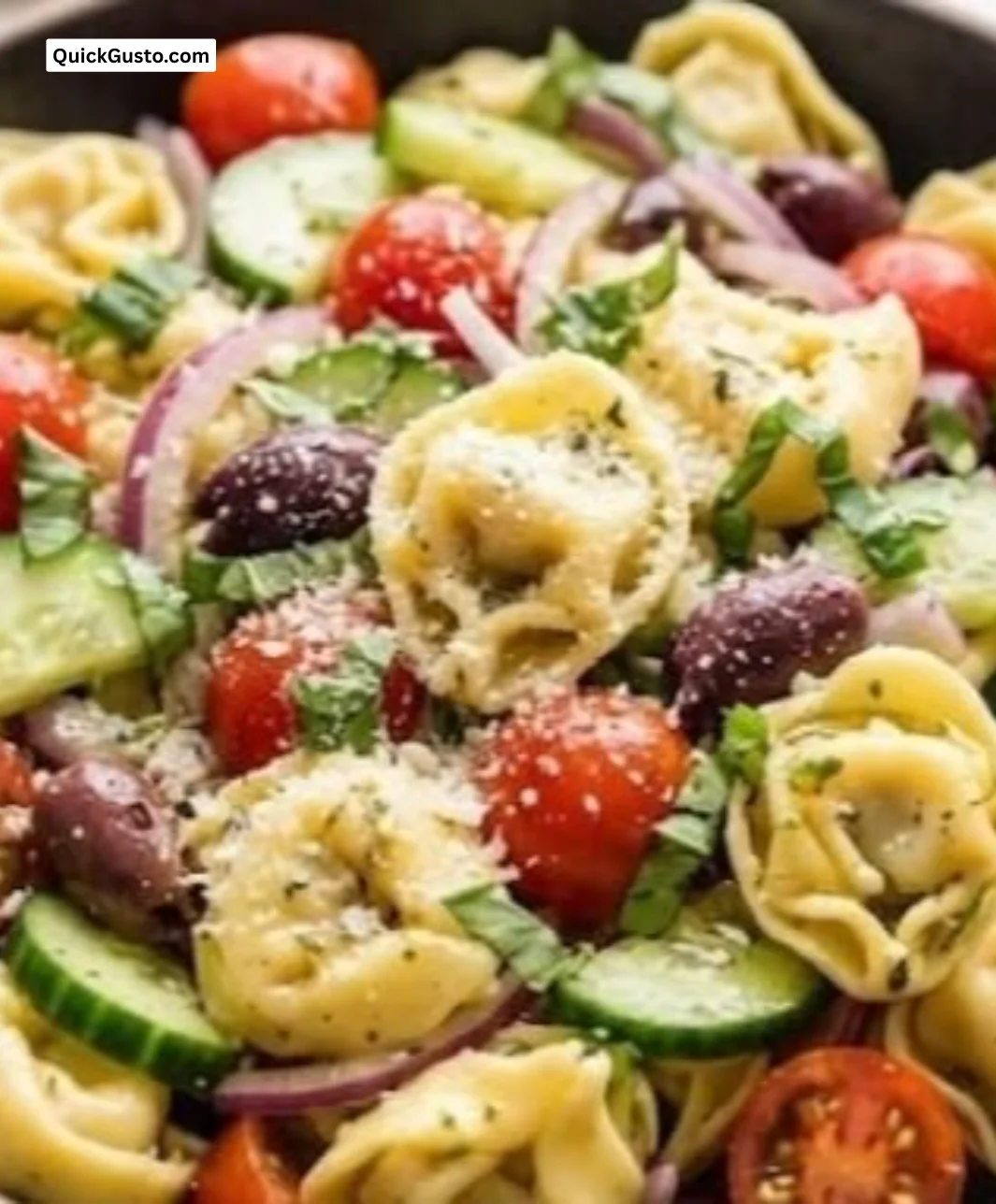 Plate of vibrant colorful pasta with fresh vegetables and sauce