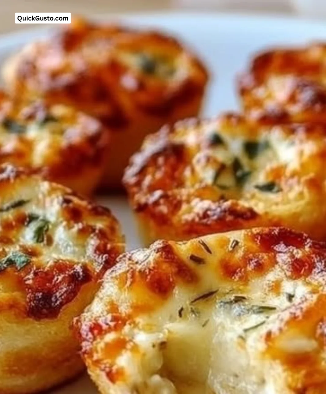 Plate of crispy cottage cheese pizza bites topped with fresh herbs and cheese