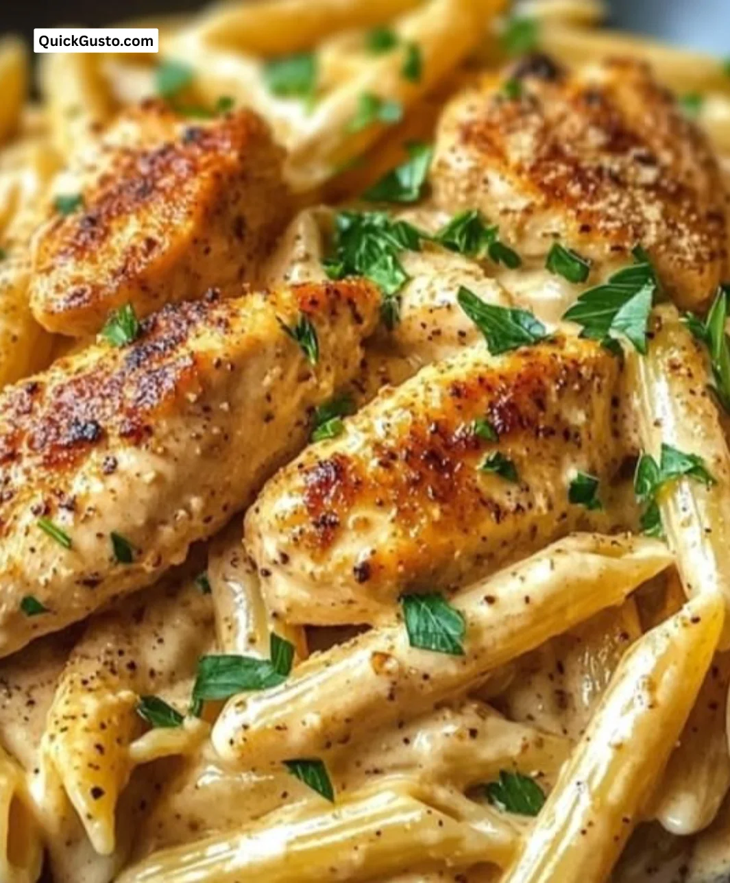 Creamy Cajun chicken penne pasta served in a bowl with herbs