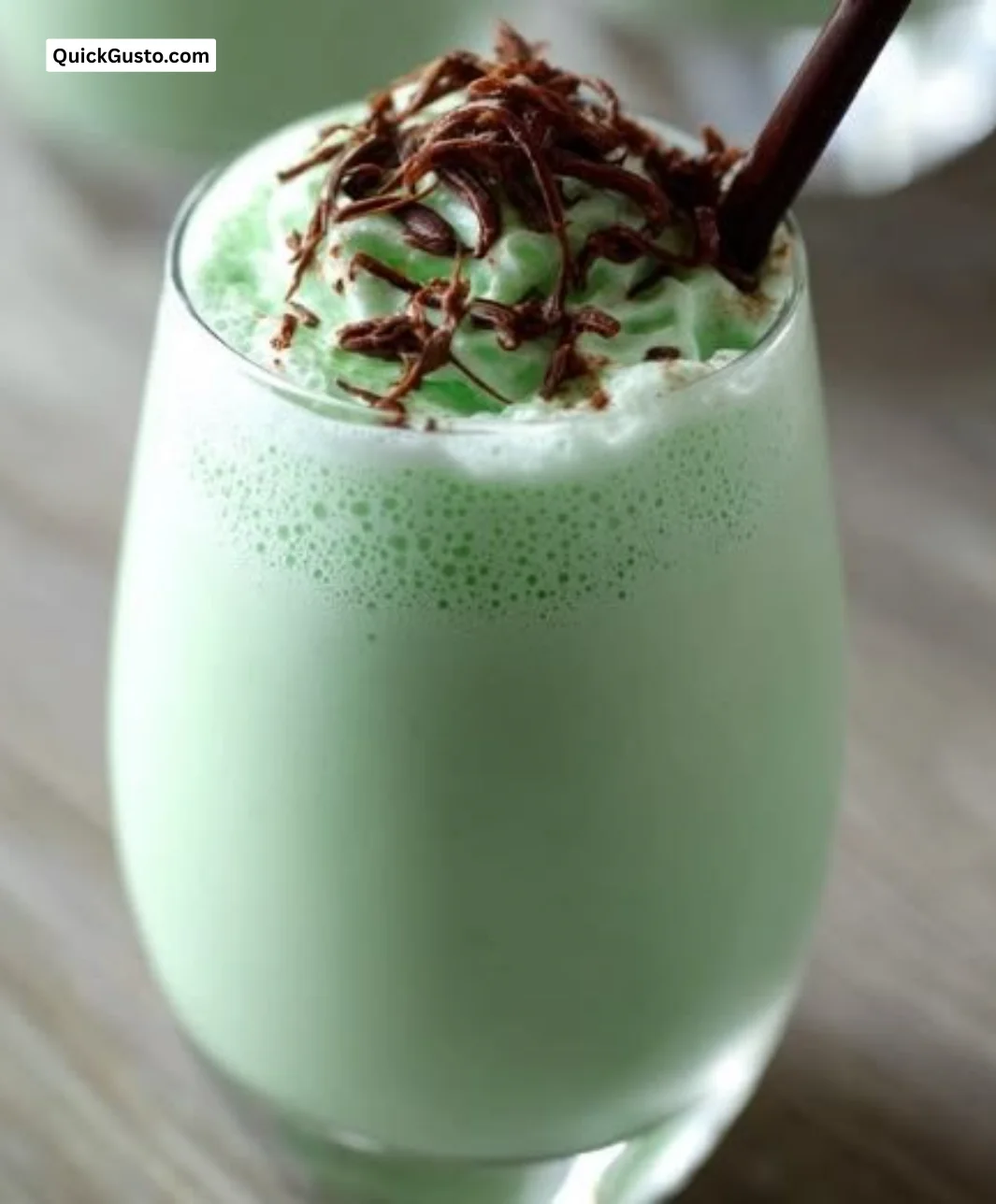 Creamy Grasshopper Cocktail garnished with mint leaves in a glass.