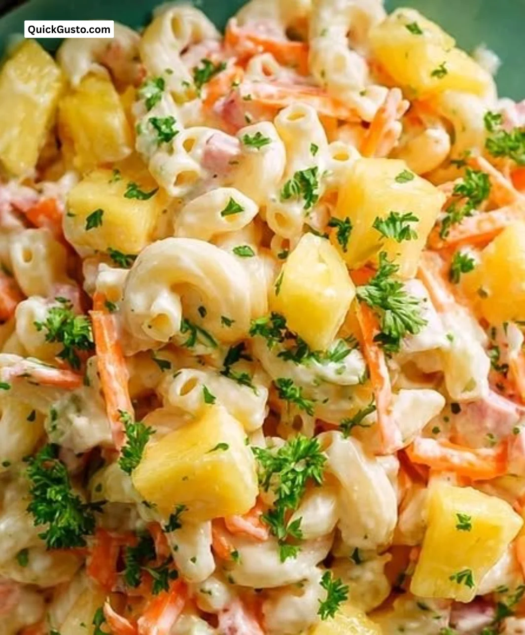 Creamy Hawaiian pasta salad with pineapple and colorful veggies in a bowl.