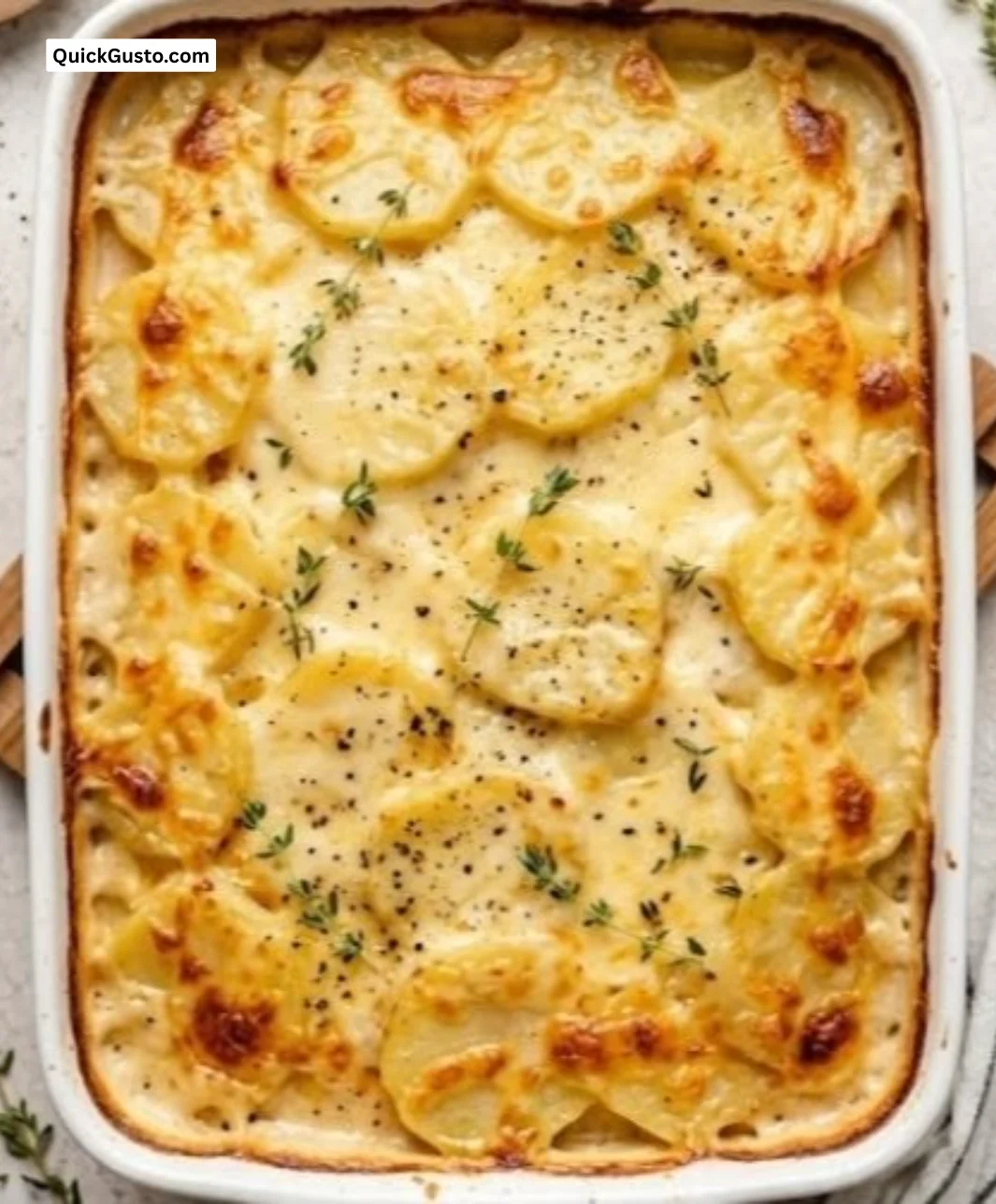 Creamy scalloped potatoes served in a dish, a classic comforting side dish.