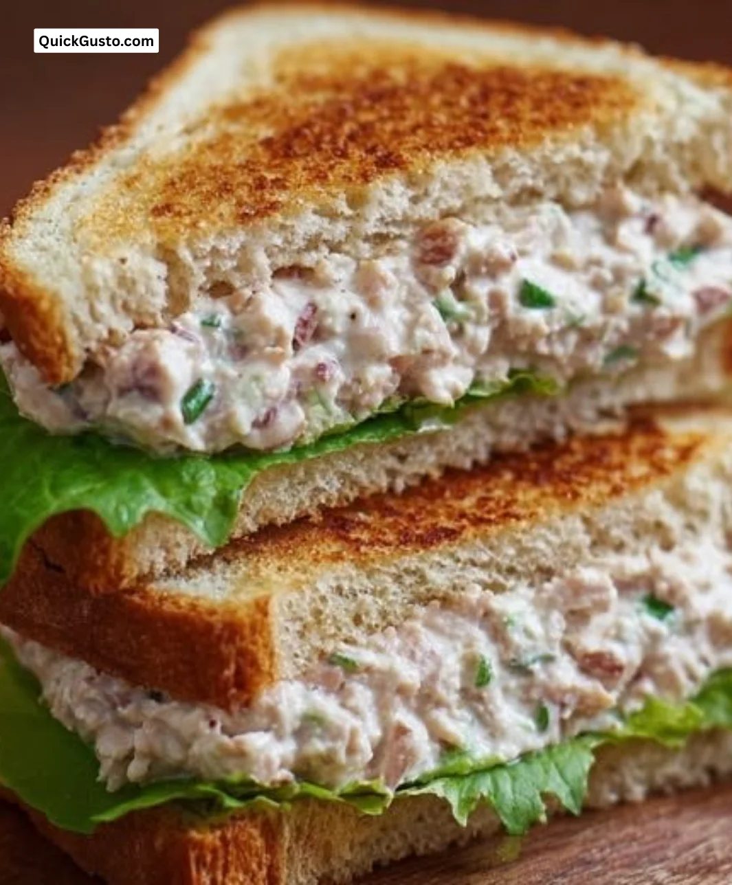 Creamy tuna sandwich spread on whole grain bread with fresh ingredients