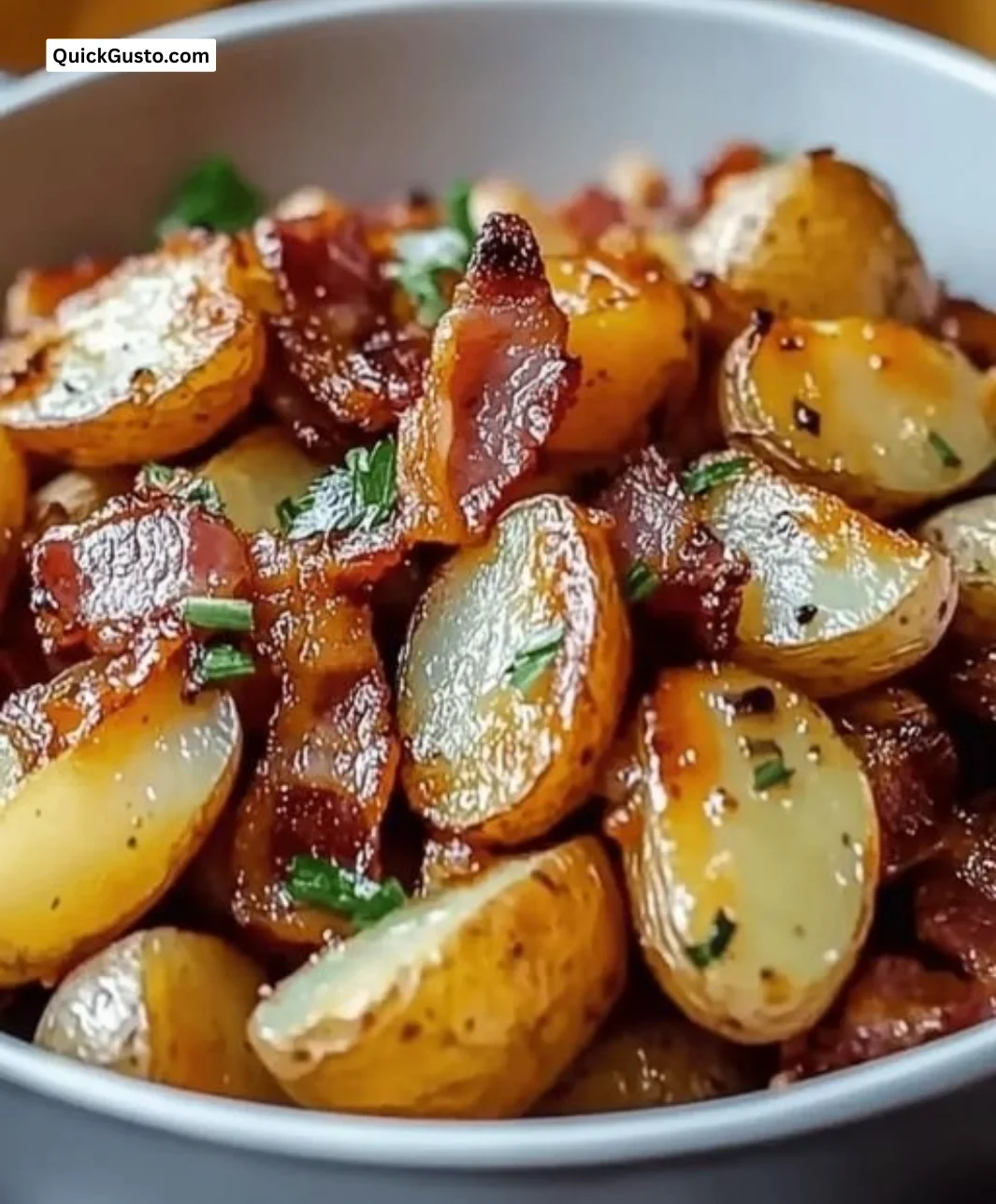 Crispy bacon honey roasted potatoes served on a plate