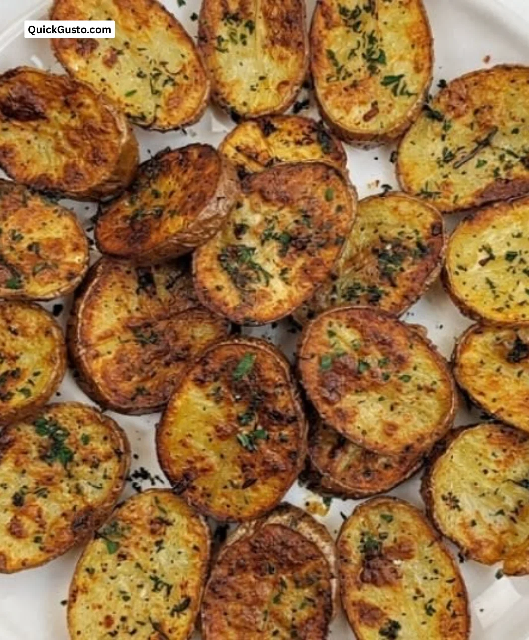 Plate of crispy Italian potatoes with garlicky seasoning, golden and crunchy