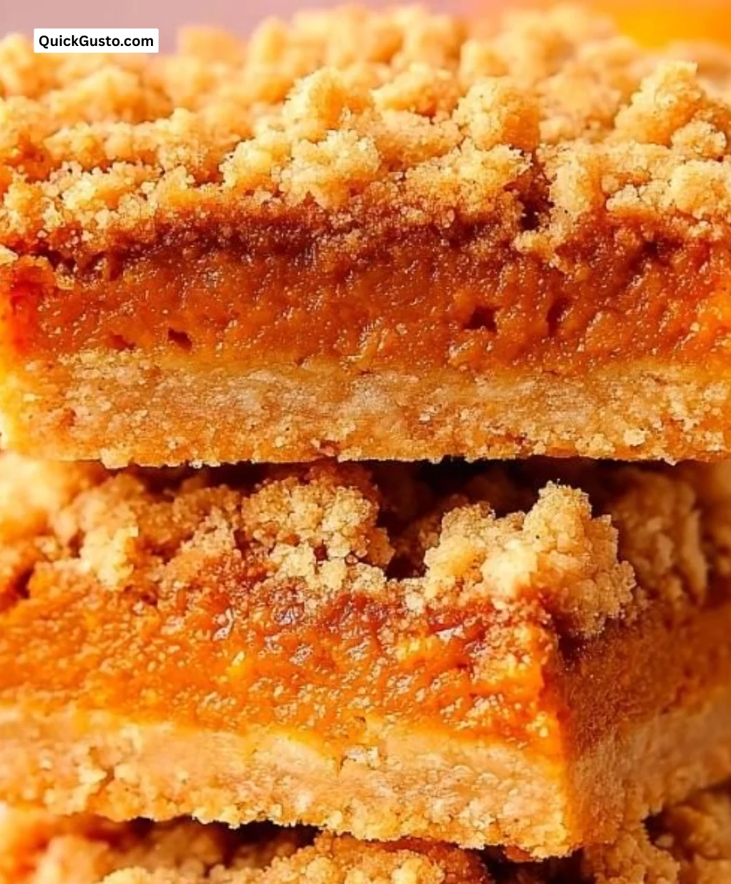 Delicious pumpkin pie crumble bars topped with a golden crumble, perfect for fall gatherings.