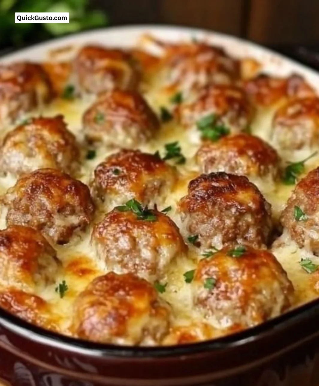 Delicious dump-and-bake meatball casserole topped with cheese and herbs