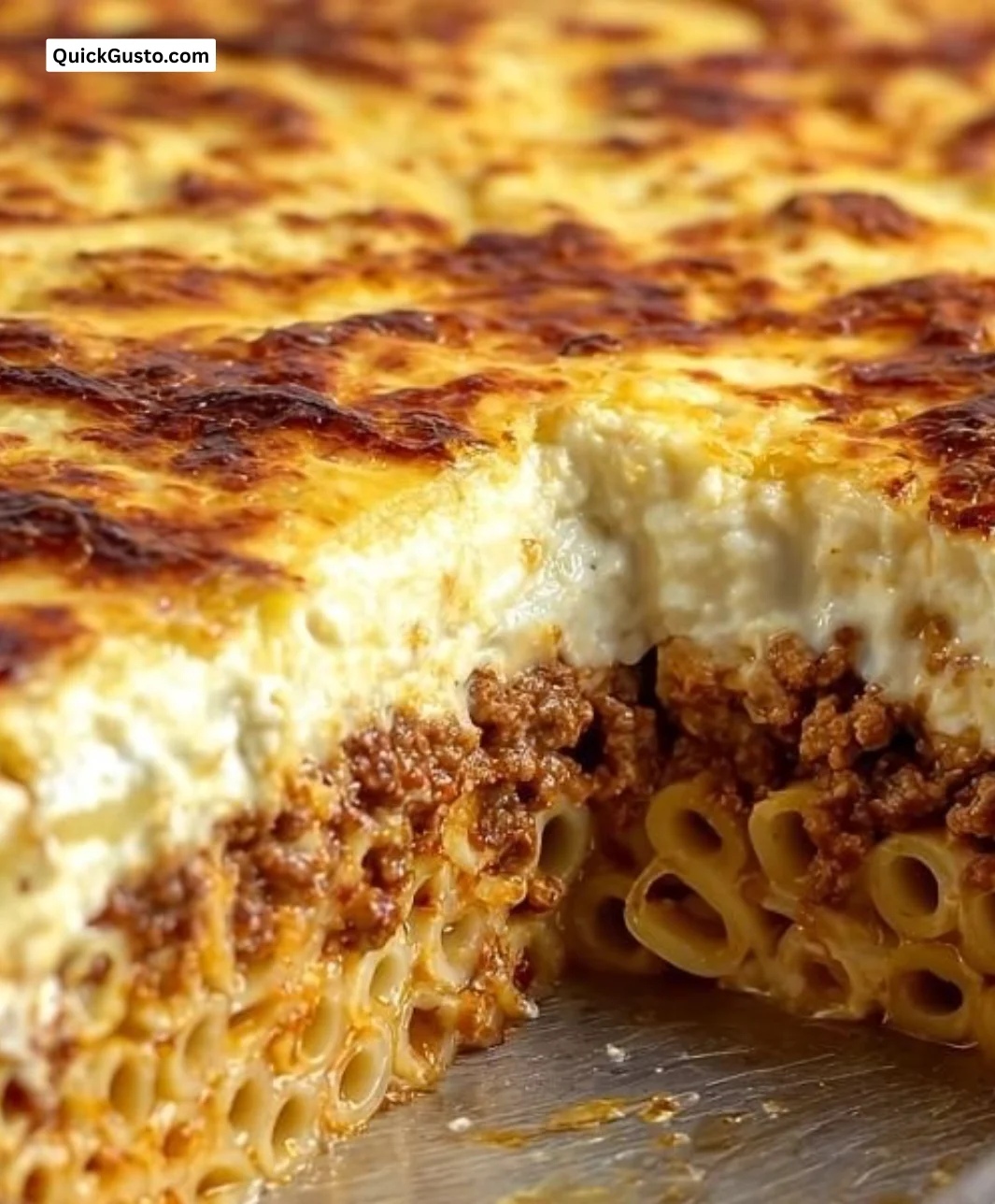 Delicious homemade Pastitsio Greek lasagna served warm with layers of pasta and meat.