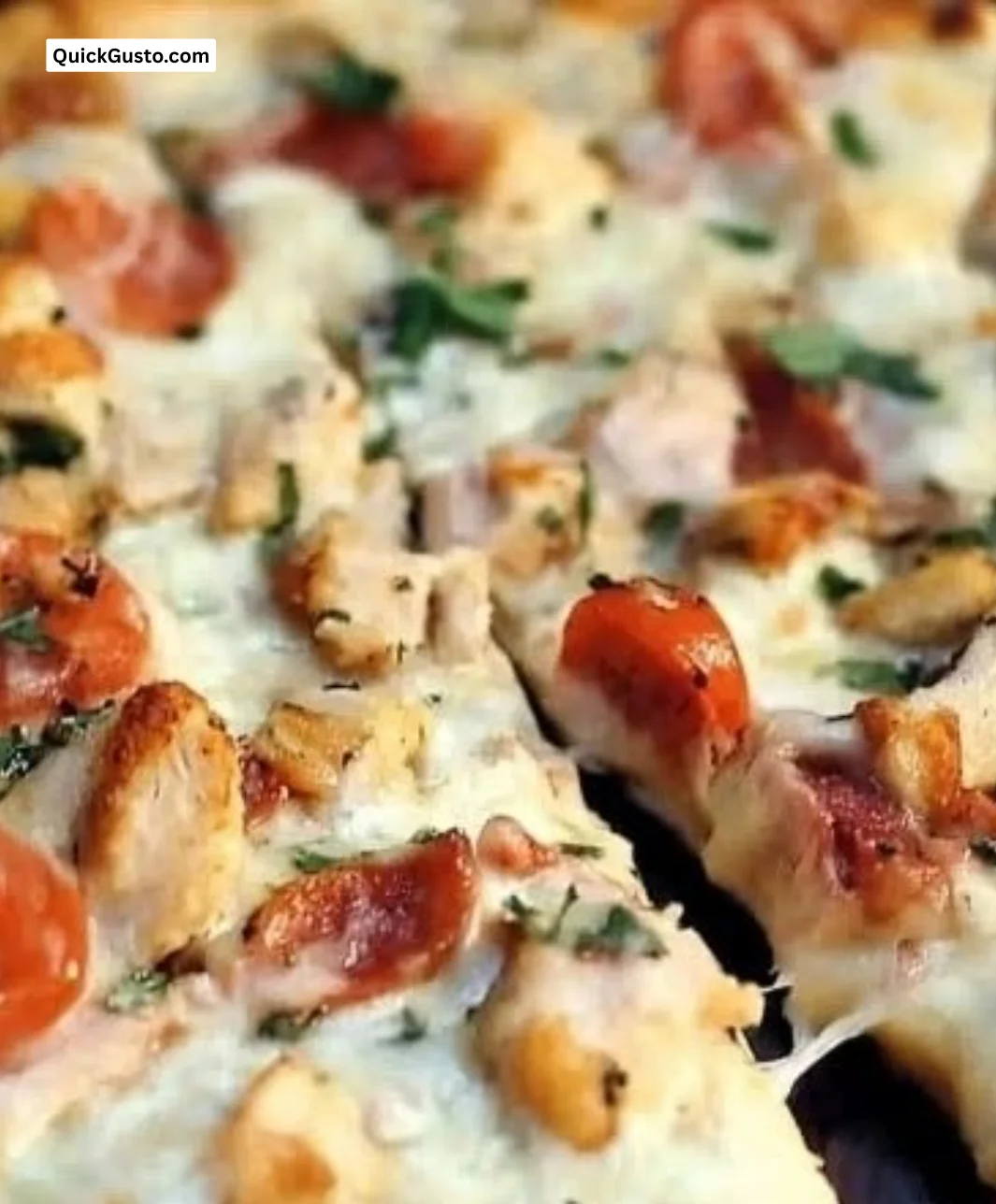 Garlic-Ranch Chicken Pizza topped with chicken and ranch dressing, crispy crust.