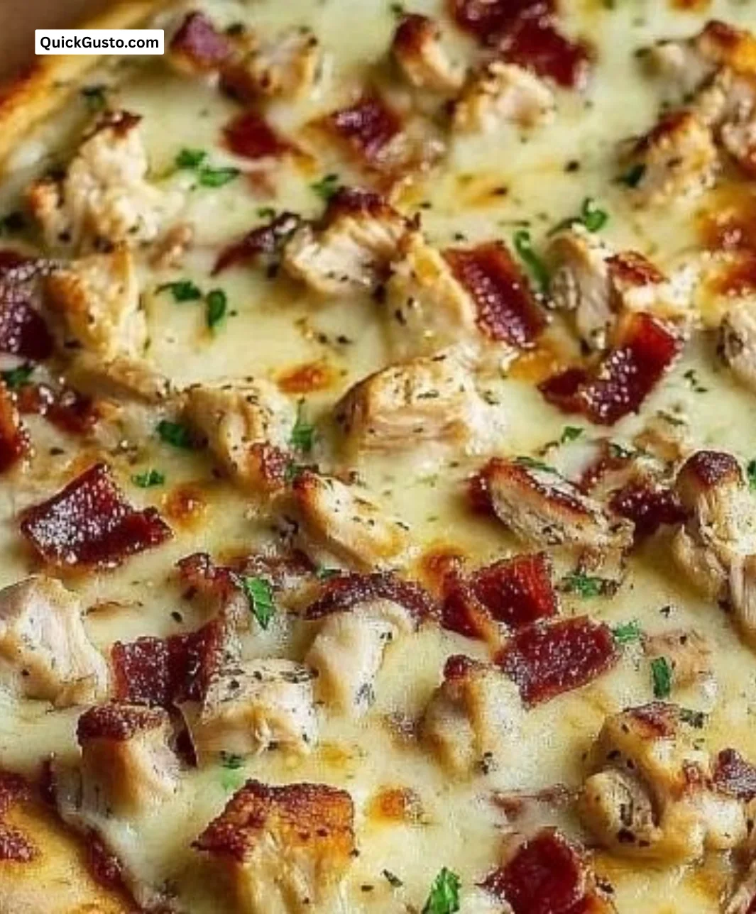 Delicious homemade Chicken Bacon Ranch Pizza topped with chicken, bacon, and ranch dressing.