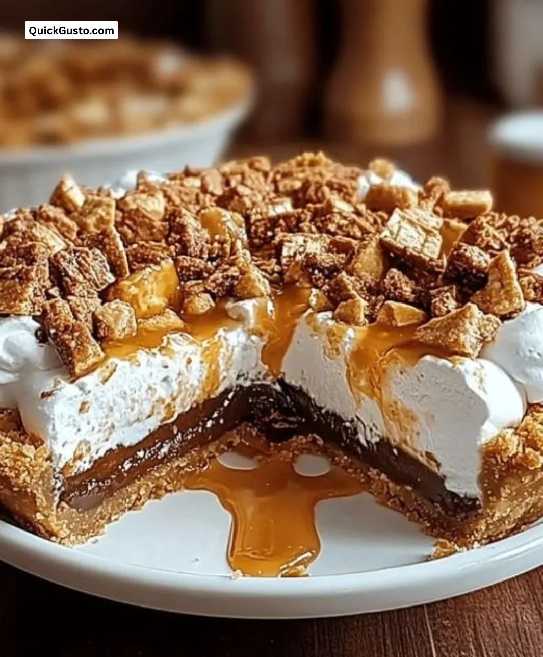 No-bake Butterfinger pie topped with crushed candy bars, perfect for dessert.