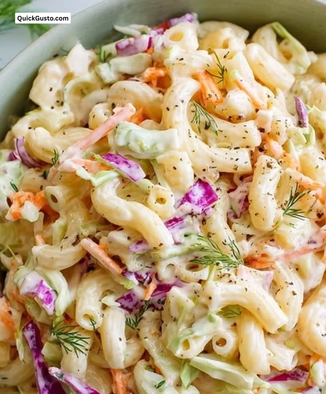 Delicious pasta salad with coleslaw dressing served in a bowl, perfect summer dish