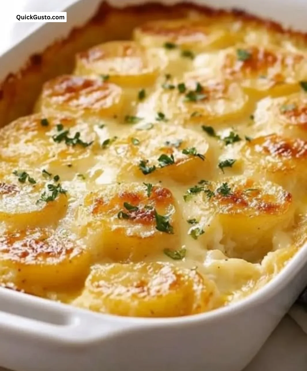 Creamy scalloped potatoes dish prepared using Paula Deen's recipe.