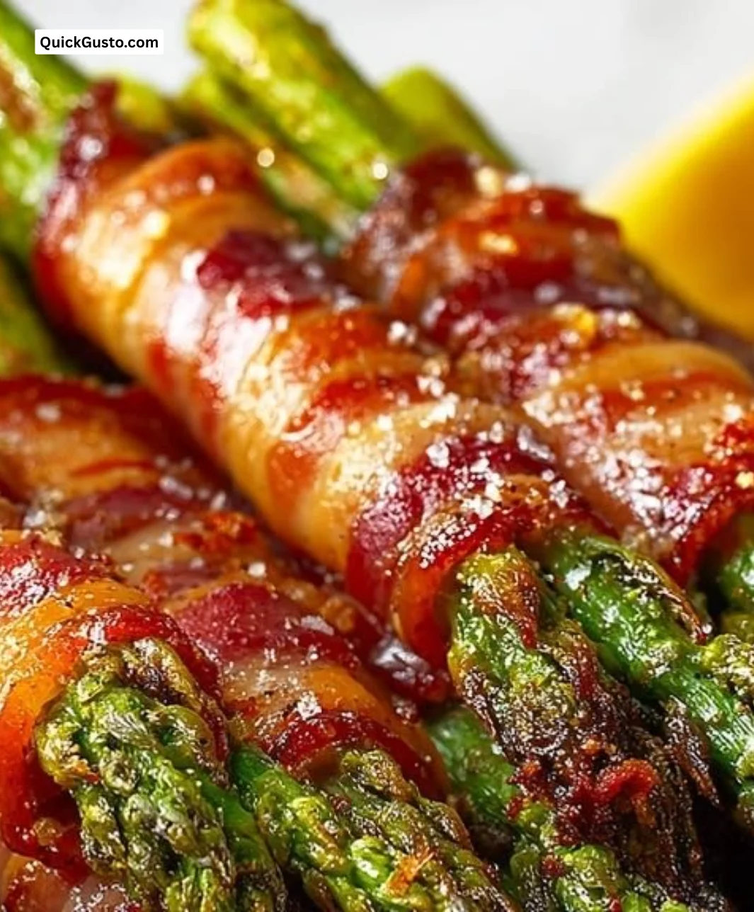 Low-carb baked bacon-wrapped asparagus served on a plate