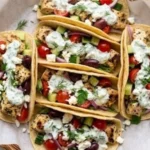 Delicious Mediterranean Chicken Tacos with fresh ingredients in a tortilla