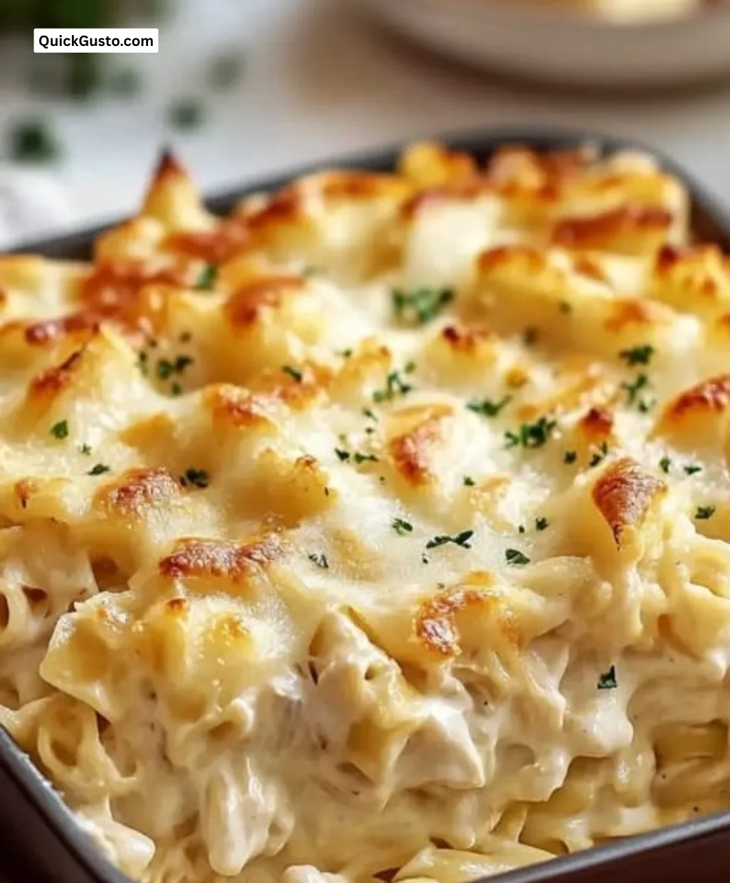 Delicious Million Dollar Chicken Alfredo Bake with creamy chicken and crispy edges