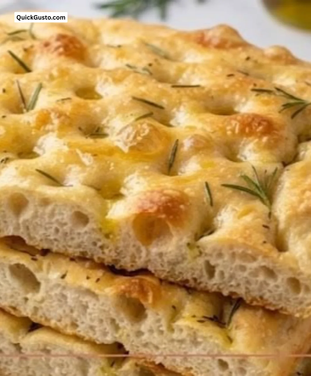 Delicious no-knead focaccia bread topped with herbs and olive oil.