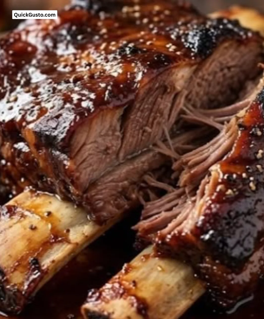 Delicious oven BBQ ribs served on a plate ready to enjoy.