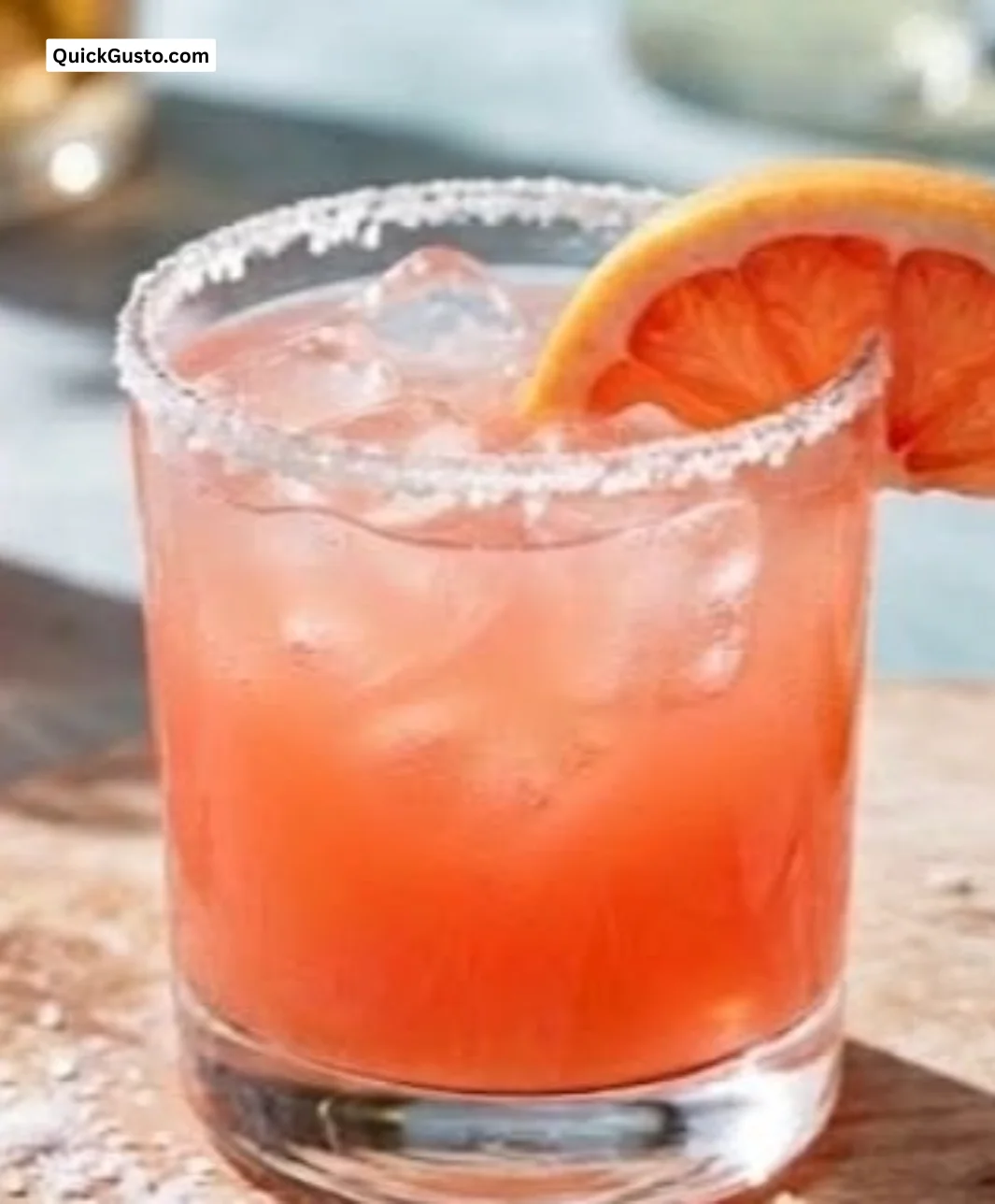 Refreshing Paloma Cocktail served in a glass with grapefruit and lime garnish