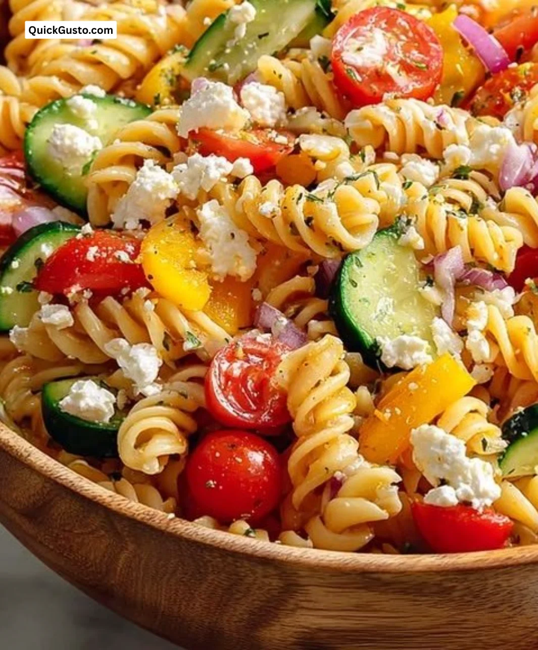 Protein-packed Greek pasta salad with fresh vegetables and zesty dressing