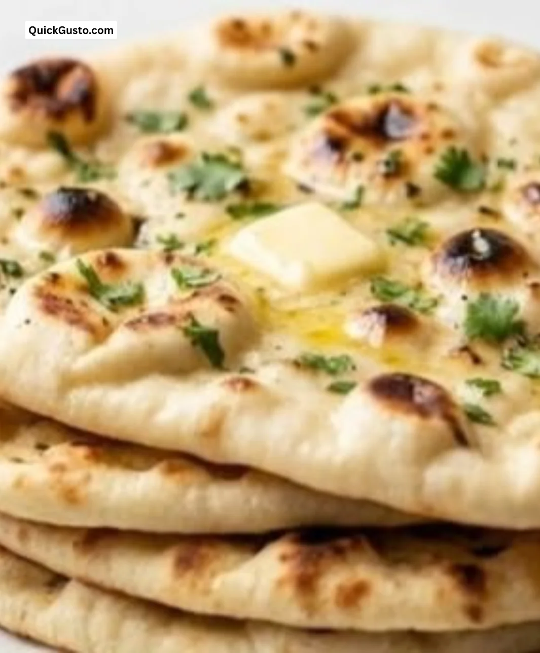 Quick garlic butter naan served with herbs and spices