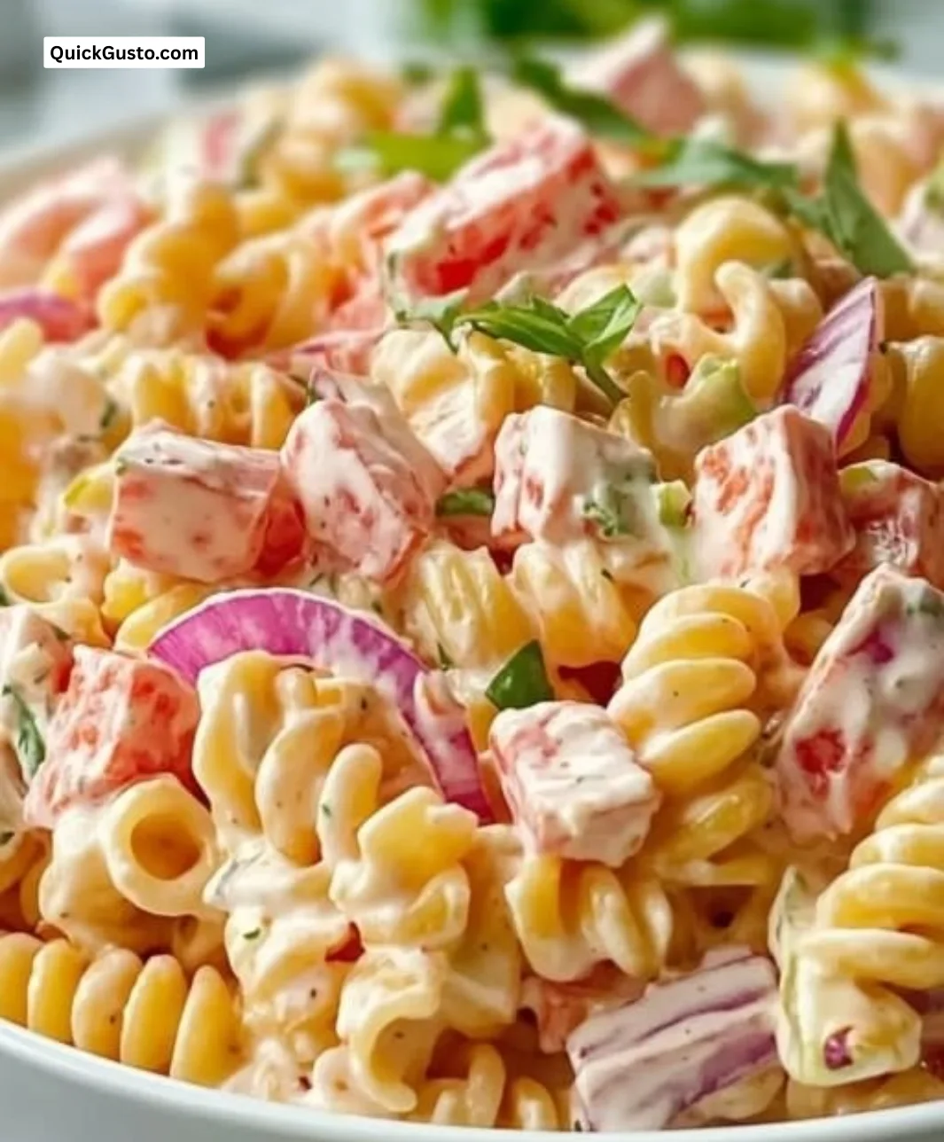 Delicious Pink Cadillac Pasta Salad served in a bowl with fresh ingredients.