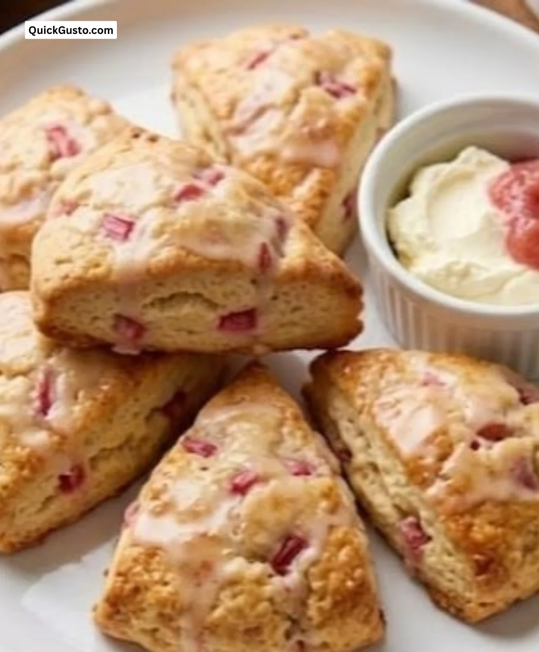 Delicious homemade rhubarb scones on a rustic kitchen table.