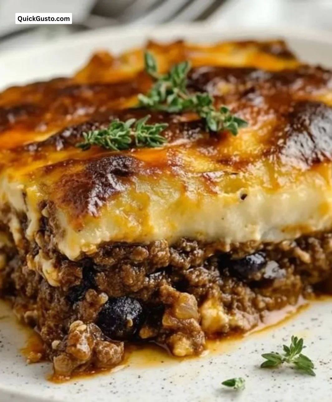 Delicious homemade Greek Moussaka served in a traditional dish