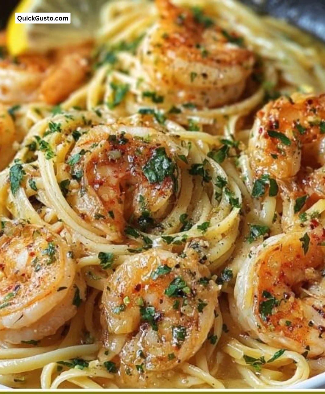 Delicious shrimp scampi served with pasta and garnished with parsley.
