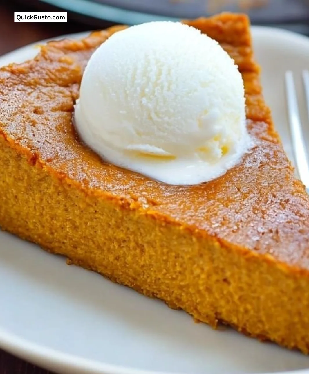 Simple crustless pumpkin pie served in a cozy autumn setting.