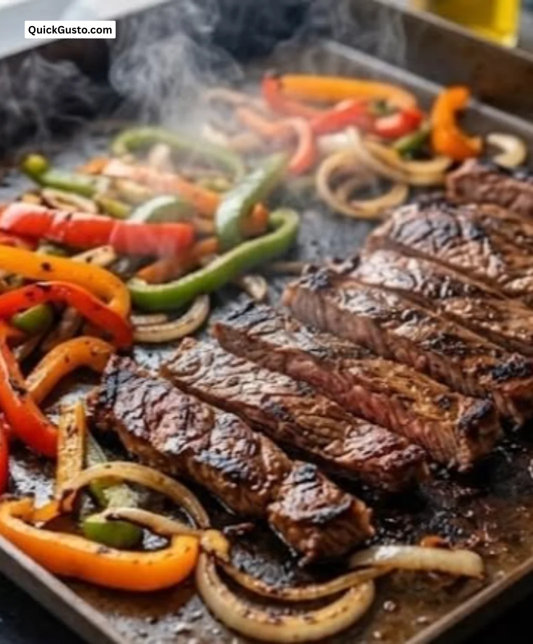 Sizzling Blackstone steak fajitas served on a colorful plate with vegetables
