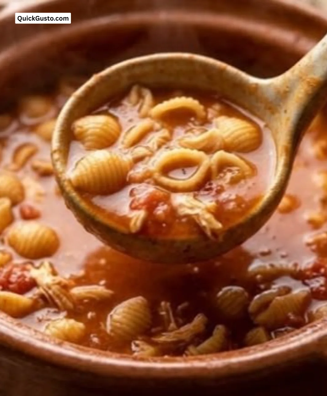 Bowl of Sopa de Conchas with shell pasta and garnishes