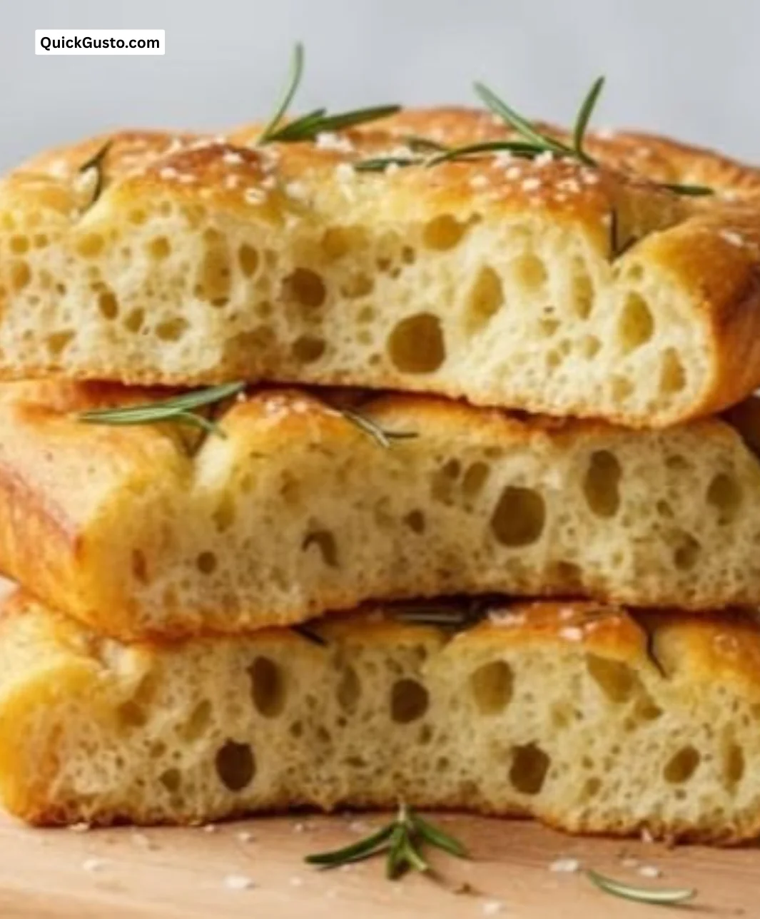 Homemade sourdough focaccia bread with herbs and olive oil.